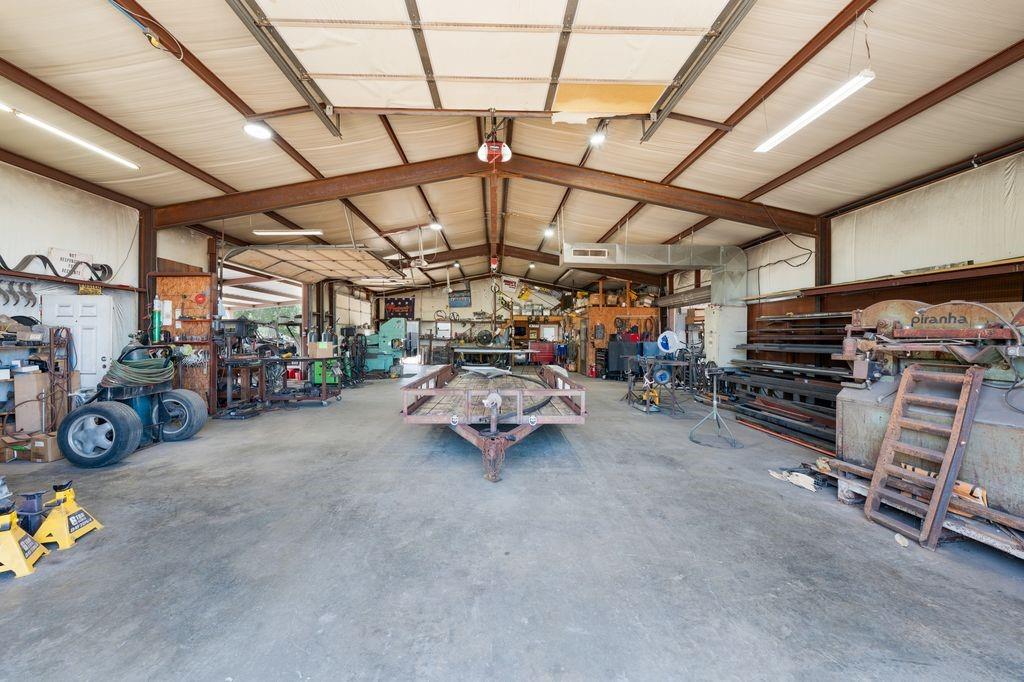 50 County Road Blossom, TX 75416 - Photo 34 of 40 a view of parking garage with cars