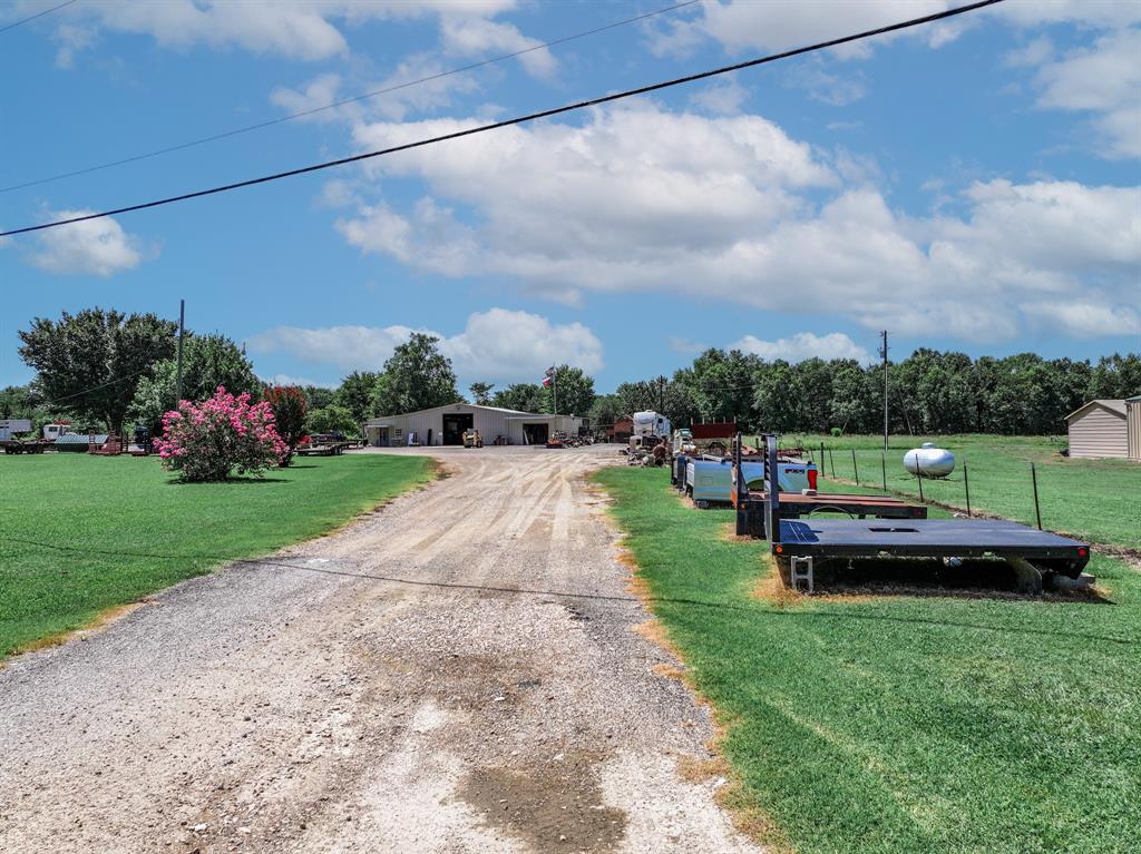 50 County Road Blossom, TX 75416 - Photo 5 of 40 a view of a garden with houses
