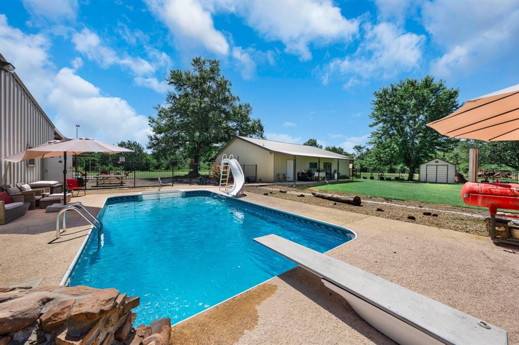 50 County Road Blossom, TX 75416 - Photo 8 of 40 a view of a backyard with swimming pool