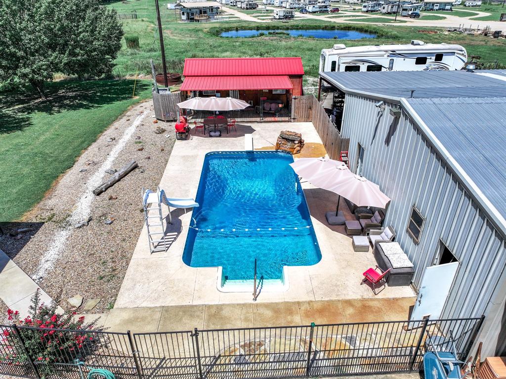 50 County Road Blossom, TX 75416 - Photo 9 of 40 a view of a patio with table and chairs potted plants with wooden floor