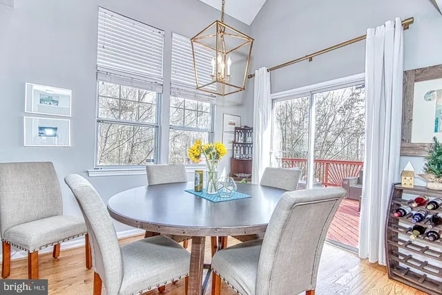 a view of a dining room with furniture and window
