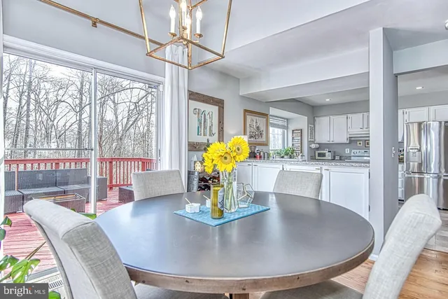 a spacious bathroom with a granite countertop sink and a mirror