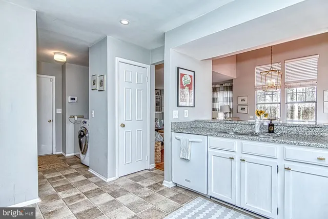 a bedroom with a bed and a mirror