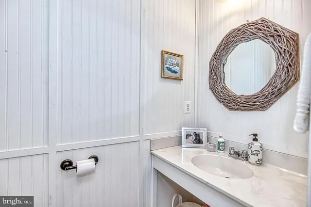 a bedroom with furniture and a chandelier