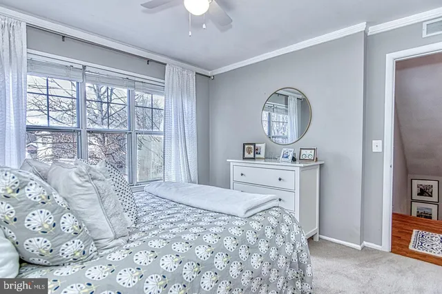 a bathroom with a toilet a sink and a mirror