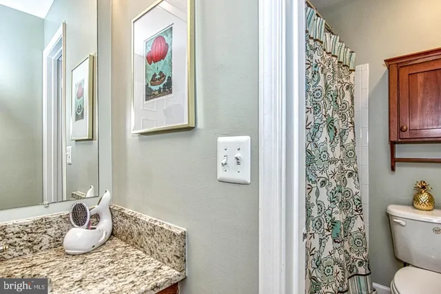 a bedroom with a large bed and a flat screen tv