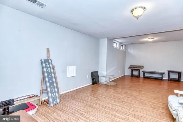 a kitchen with cabinets and window