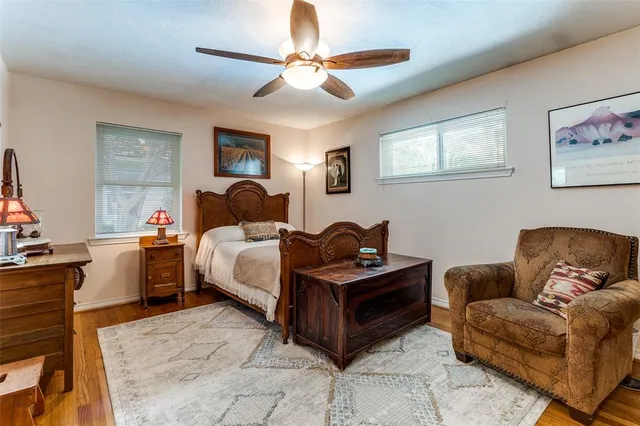 a bedroom with furniture and a window