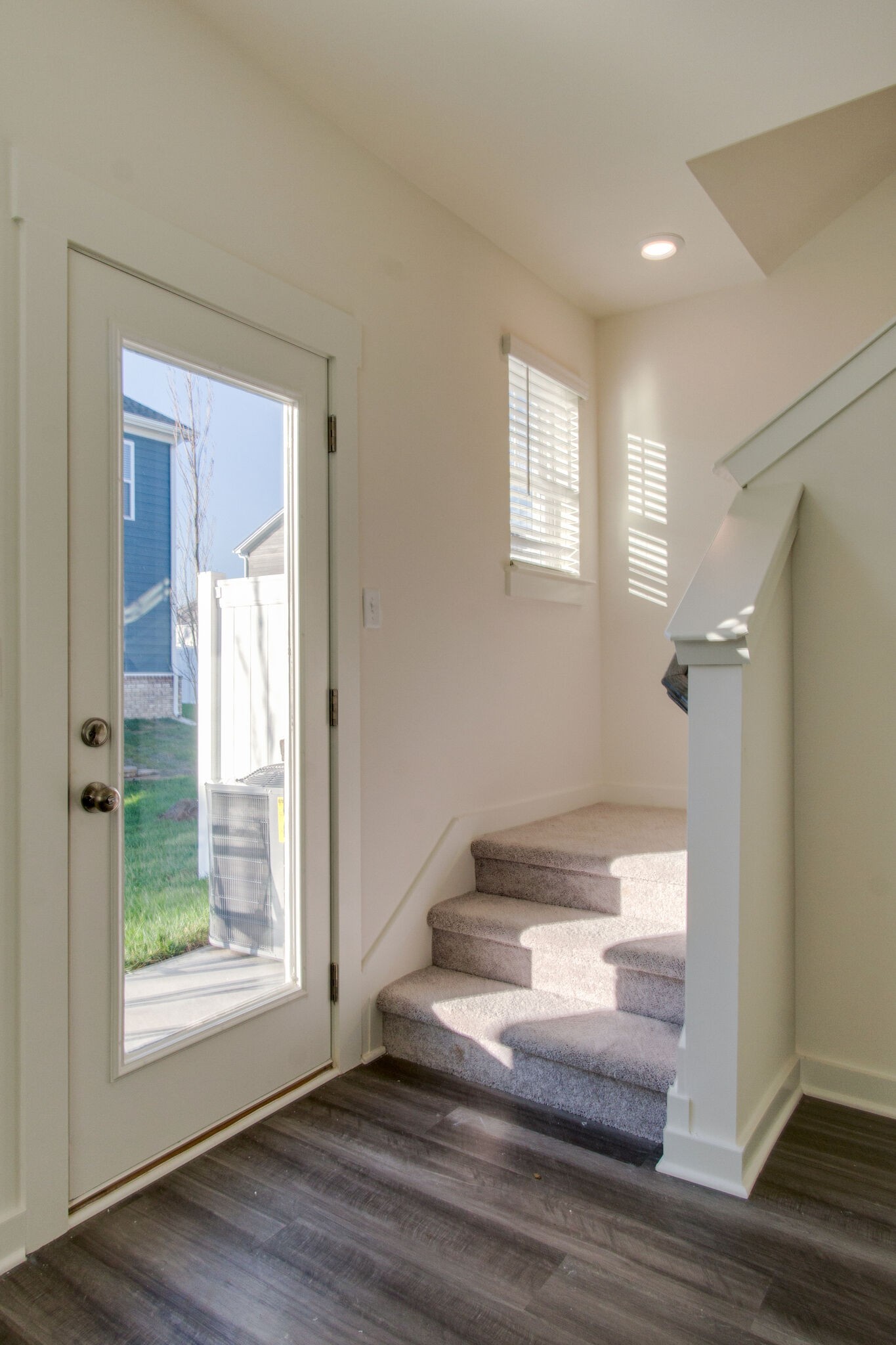 1703 Frodo Way Murfreesboro, TN 37128 - Photo 12 of 25 a view of an empty room with wooden floor and a window