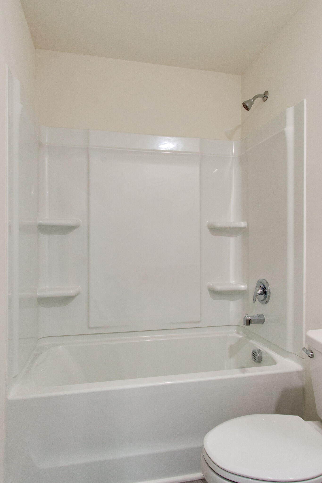 1703 Frodo Way Murfreesboro, TN 37128 - Photo 22 of 25 a bathroom with a toilet and a bathtub