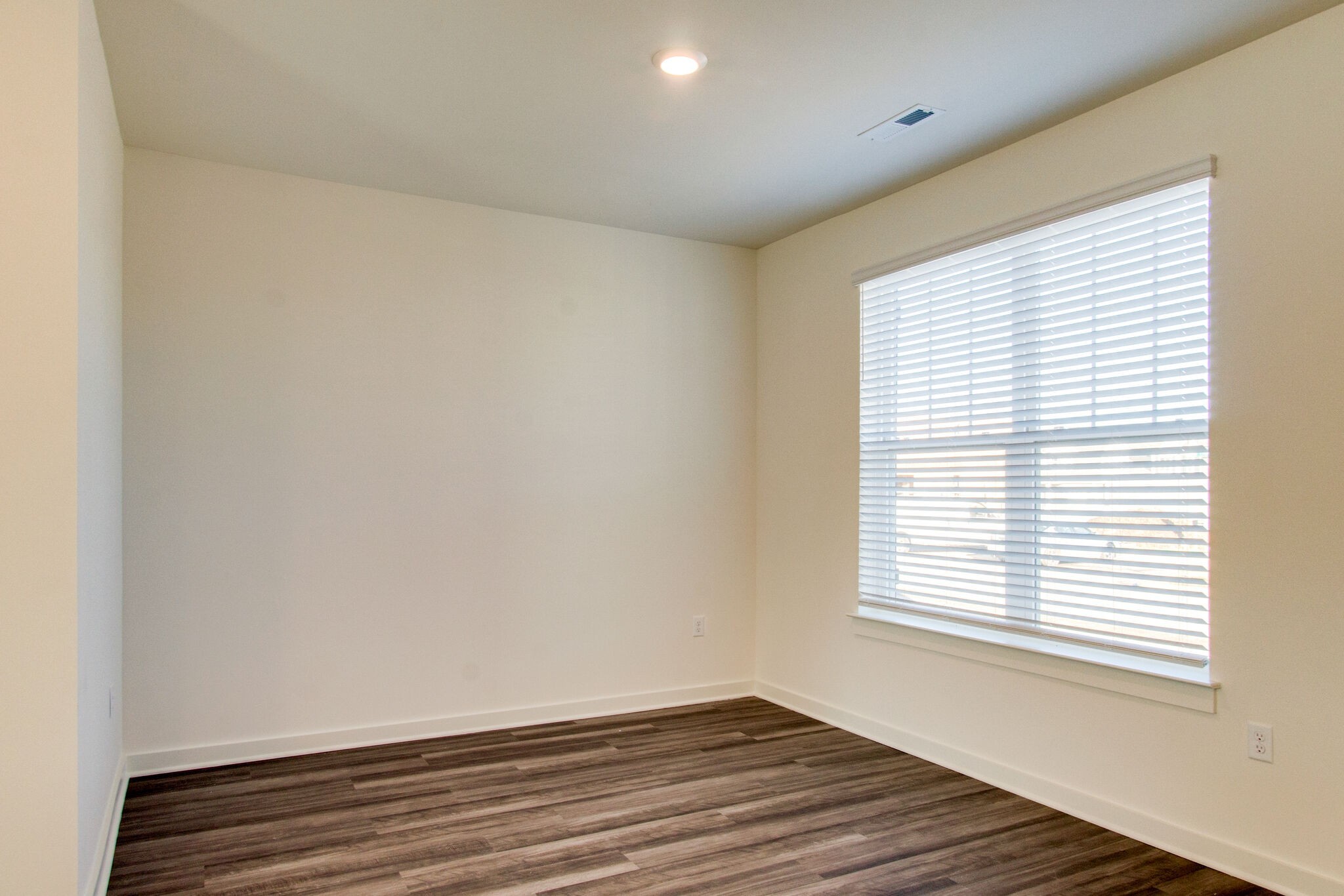 1703 Frodo Way Murfreesboro, TN 37128 - Photo 8 of 25 a view of an empty room with wooden floor and a window