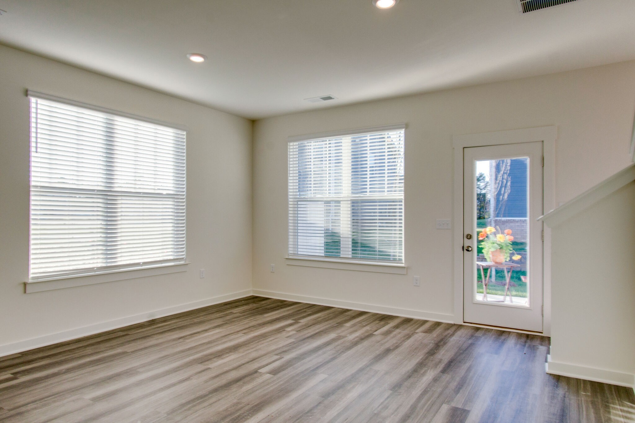 1703 Frodo Way Murfreesboro, TN 37128 - Photo 9 of 25 a view of an empty room with wooden floor and a window