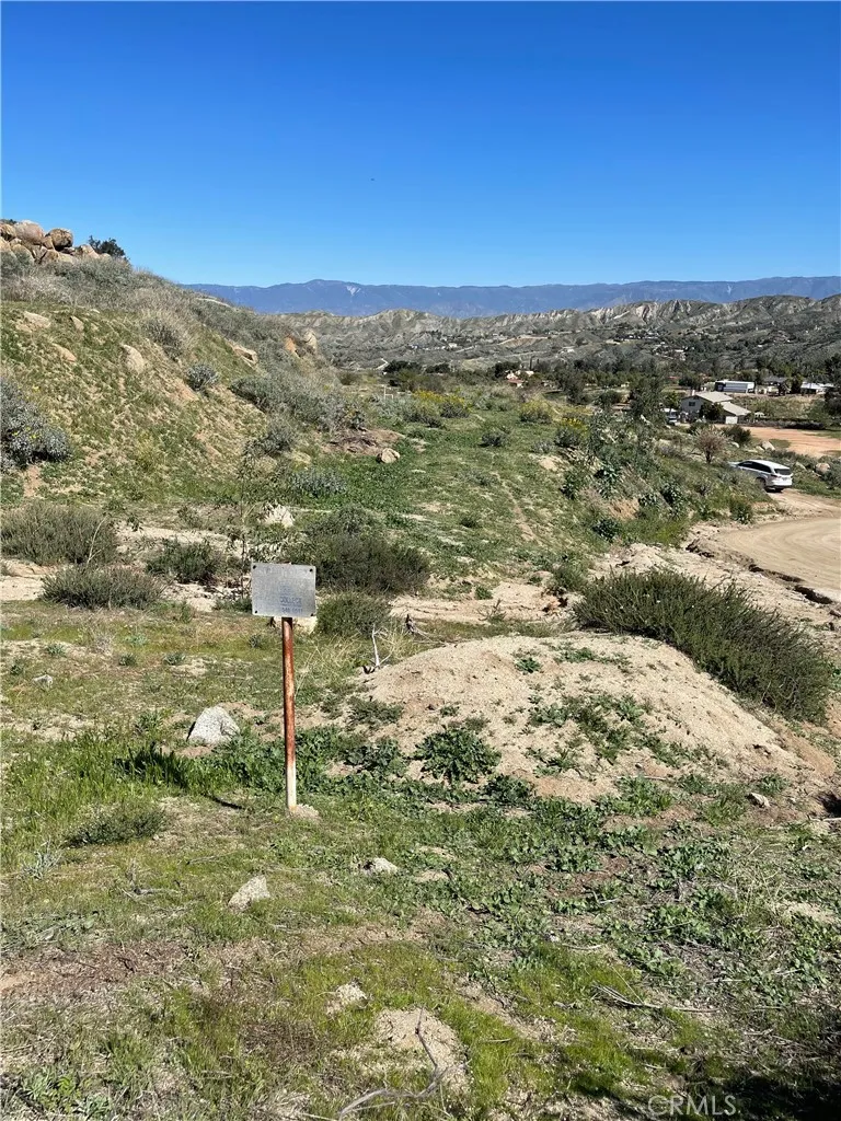 53 Spring Colton Ca Colton, CA 92324 - Photo 9 of 12 a view of a big yard with a building in the background