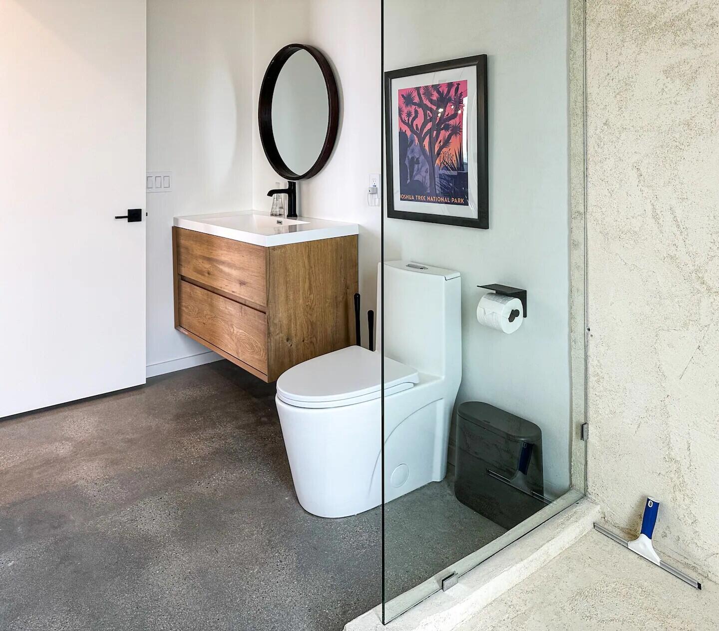 63730 Hollinger Road Joshua Tree, CA 92252 - Photo 26 of 31 a bathroom with a sink a toilet and a mirror