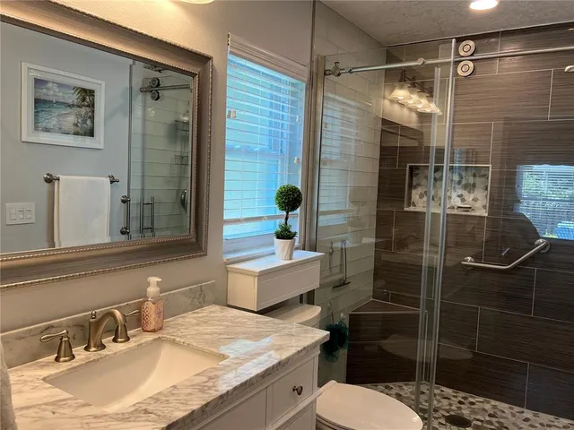 a view of a patio with a table and chairs in patio