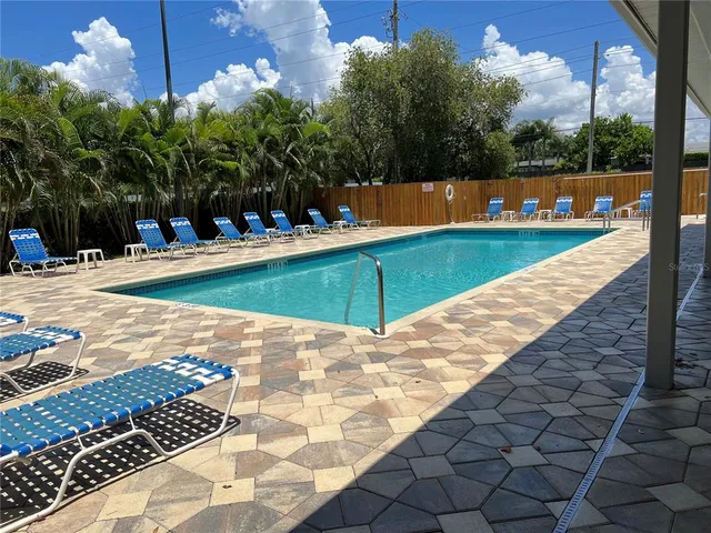 a kitchen with granite countertop wooden cabinets and a stove top oven