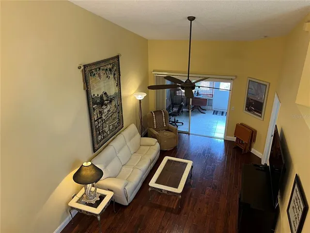 a view of a patio with a table and chairs under an umbrella