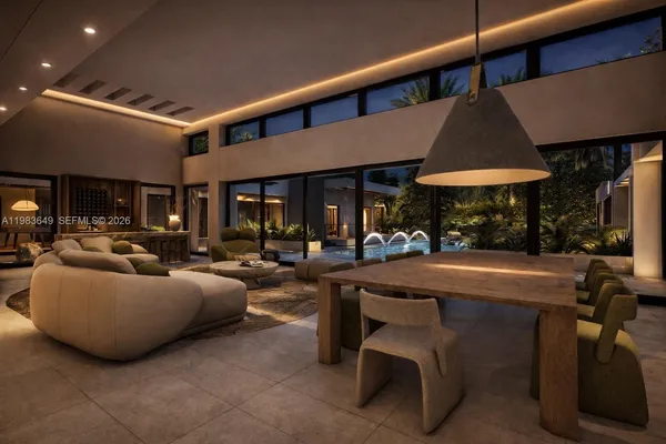 a living room with furniture a table and chairs