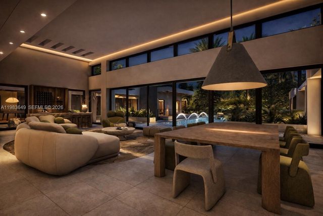 a living room with furniture a table and chairs