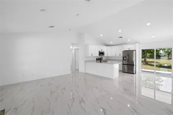a view of kitchen with wooden floor