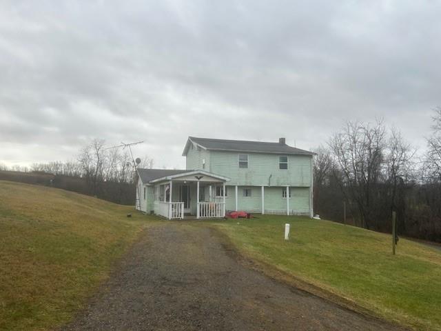 231 Hill Road Georgetown, PA 15043 - Photo 31 of 31 Back of home view with sitting porch and sunroom