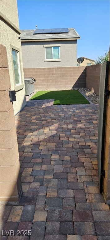 7050 Fossil Rim Street North Las Vegas, NV 89084 - Photo 3 of 19 Fenced backyard featuring a patio