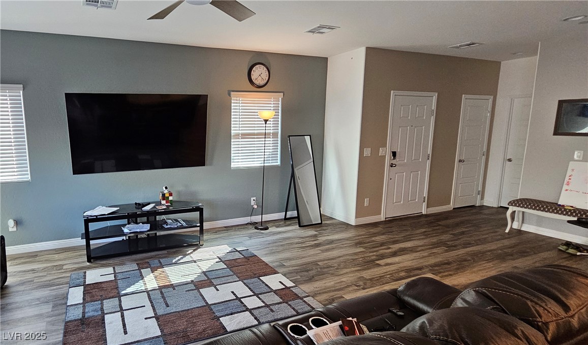 7050 Fossil Rim Street North Las Vegas, NV 89084 - Photo 8 of 19 Living room with wood finished floors and ceiling fan