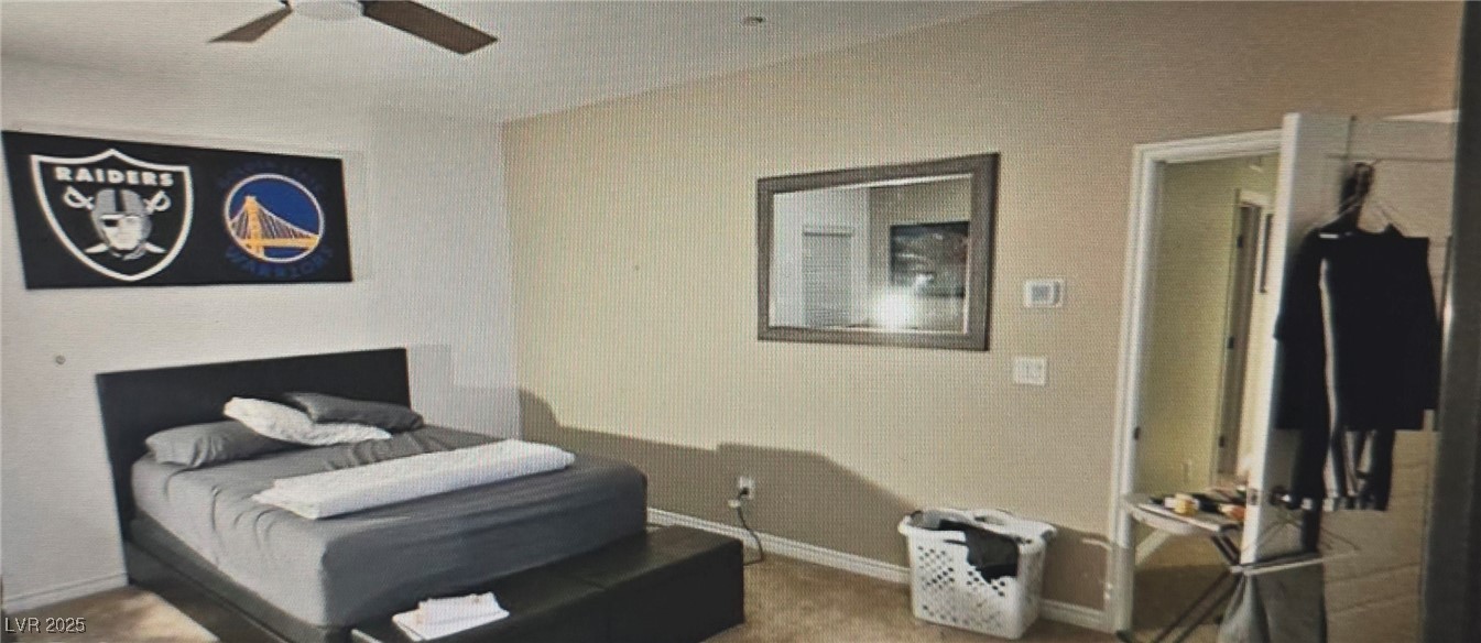 7050 Fossil Rim Street North Las Vegas, NV 89084 - Photo 9 of 19 Bedroom featuring baseboards and a ceiling fan