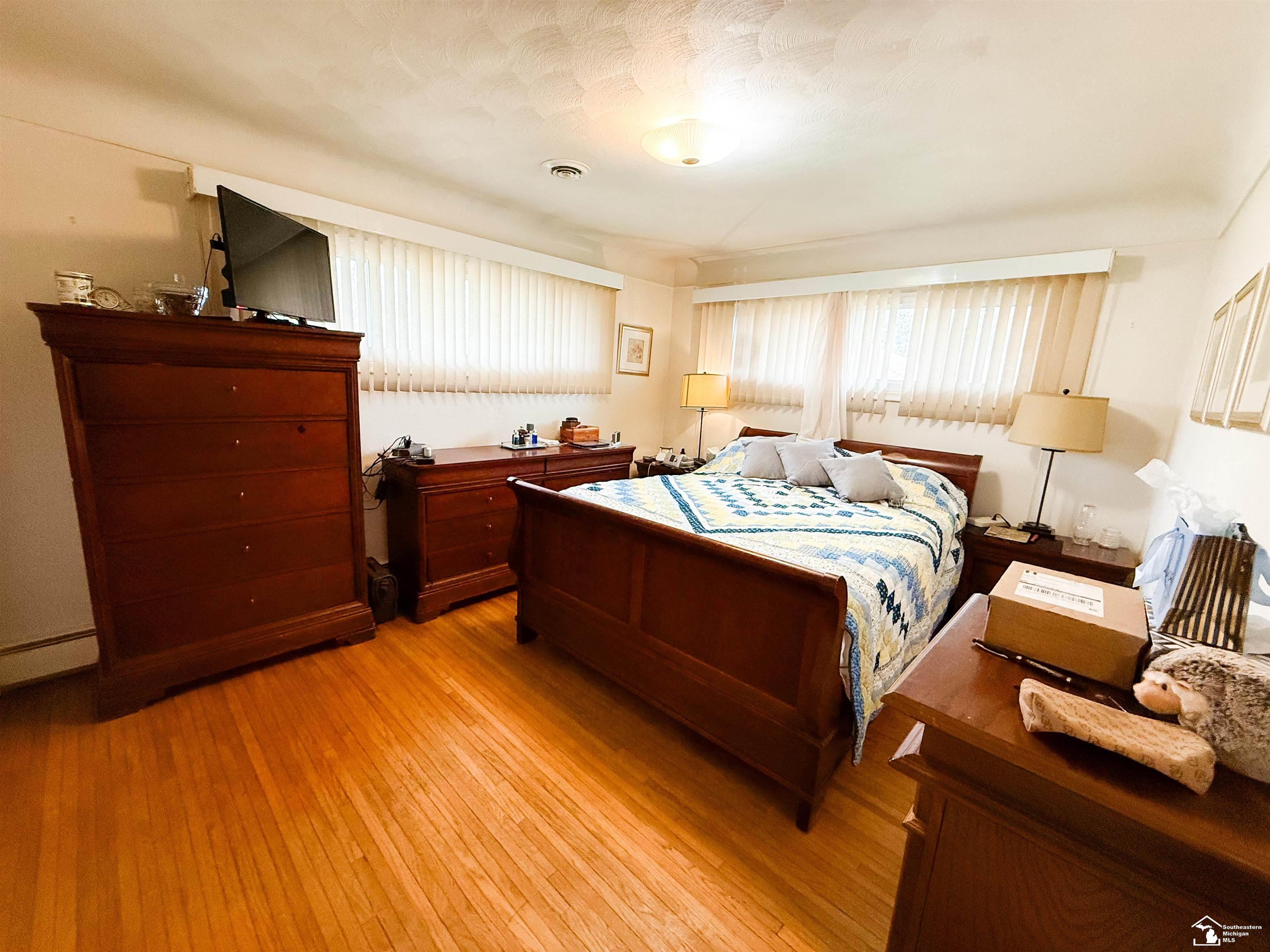4230 St Anthony Road Temperance, MI 48182 - Photo 27 of 32 Bedroom with Hardwood flo