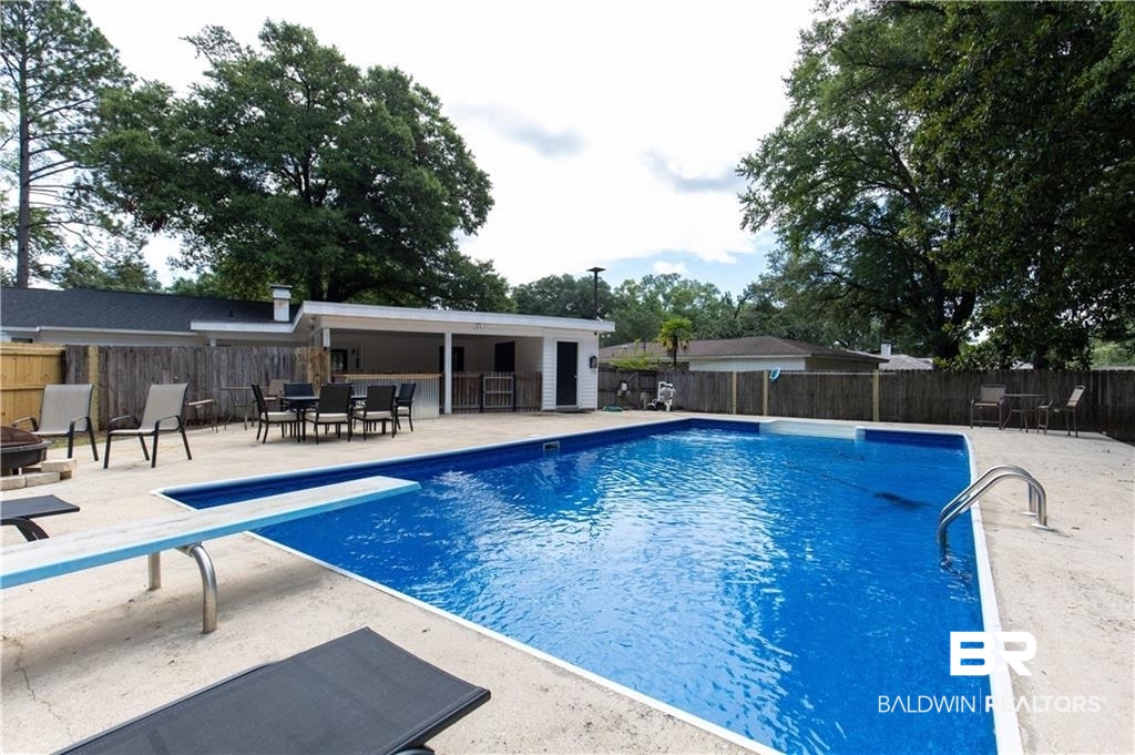 1624 Apex Drive Mobile, AL 36693 - Photo 5 of 29 View of pool with a diving board and a patio area