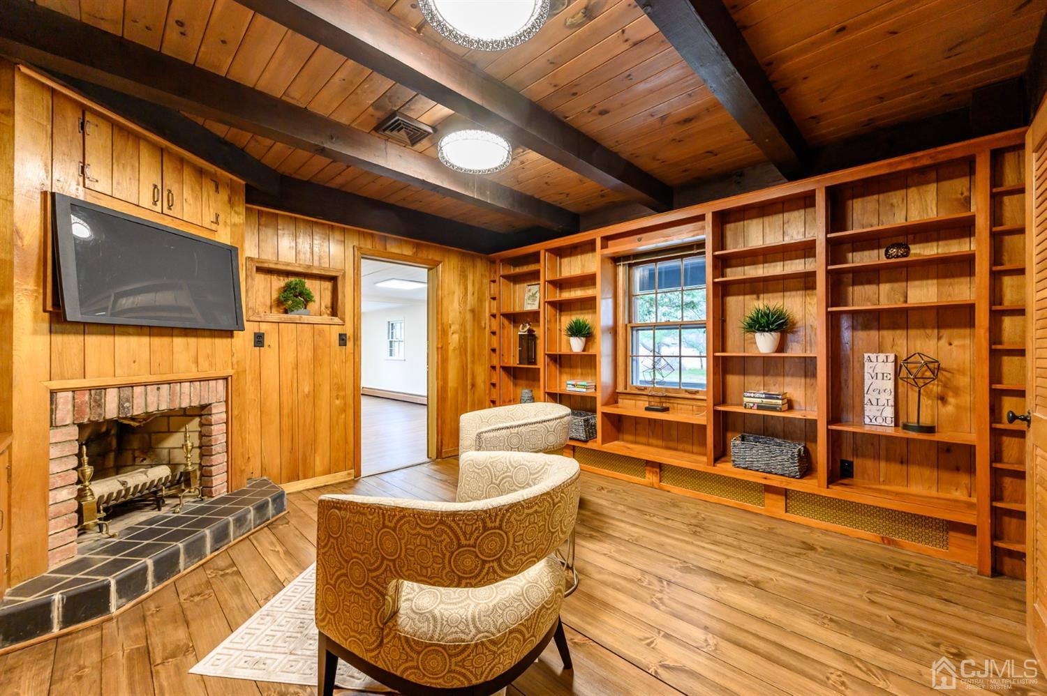 34 Mt Horeb Road Warren, NJ 07059 - Photo 12 of 55 a dining room with furniture a fireplace and wooden floor
