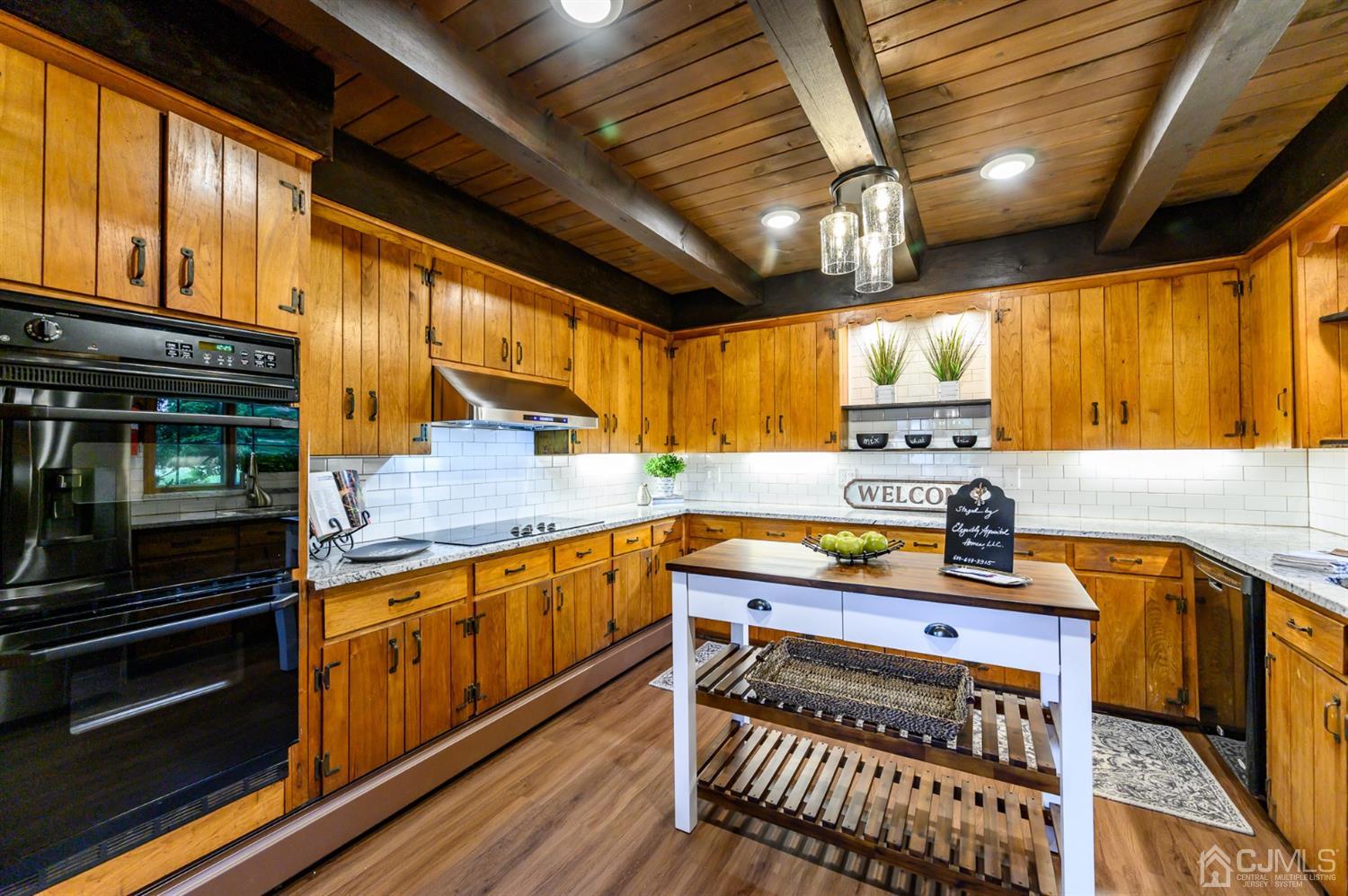 34 Mt Horeb Road Warren, NJ 07059 - Photo 30 of 55 a kitchen with stainless steel appliances a stove a sink and cabinets