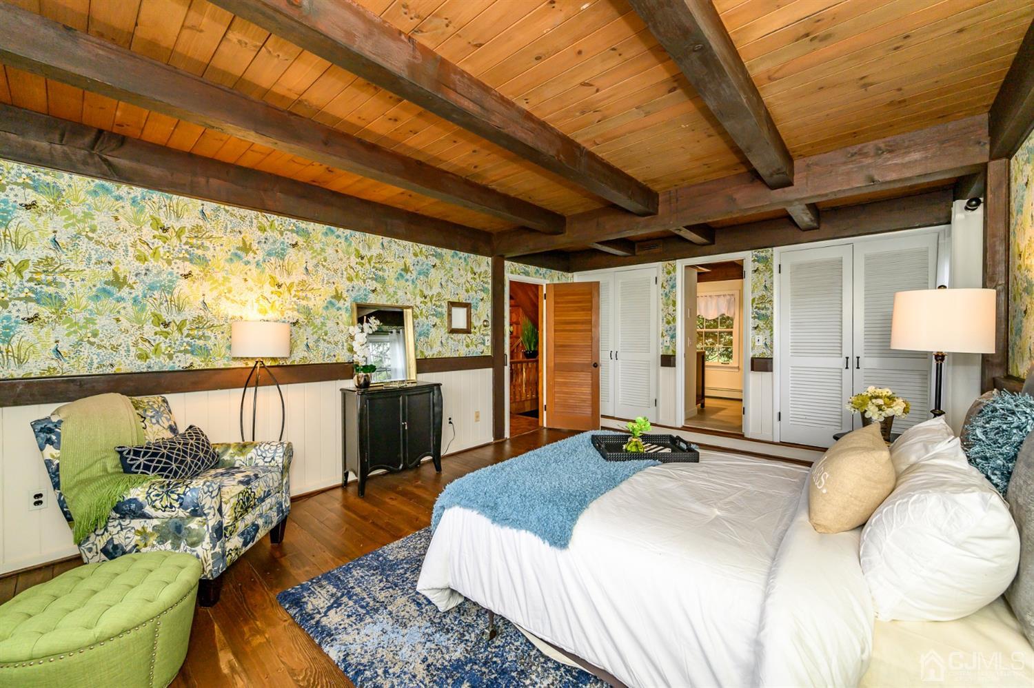 34 Mt Horeb Road Warren, NJ 07059 - Photo 8 of 55 a bedroom with a large bed and a chandelier
