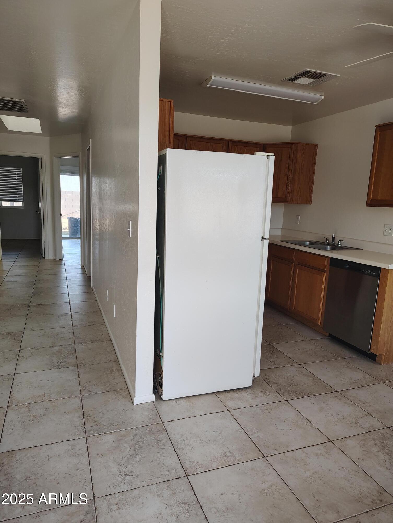 1471 East 27th Avenue, Unit 2 Apache Junction, AZ 85119 - Photo 5 of 16 a kitchen with stainless steel appliances granite countertop a refrigerator and a stove