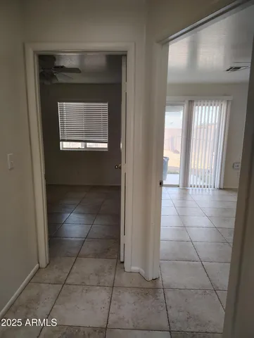 a view of hallway with a window and a mirror
