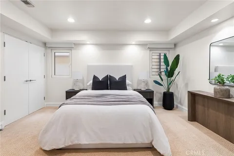 a bedroom with a bed and window