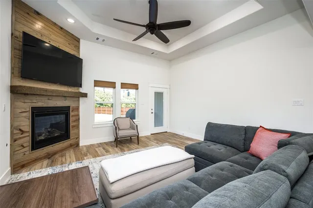 a kitchen with stainless steel appliances granite countertop a sink a stove and refrigerator