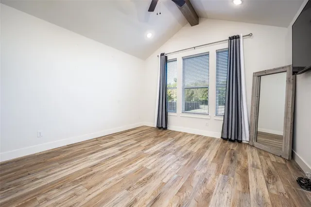 a view of kitchen with refrigerator and window