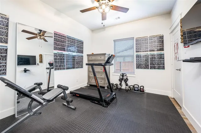 a spacious bathroom with a granite countertop sink a mirror and a shower