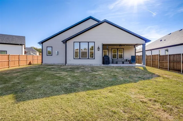 a utility room with sink dryer and washer