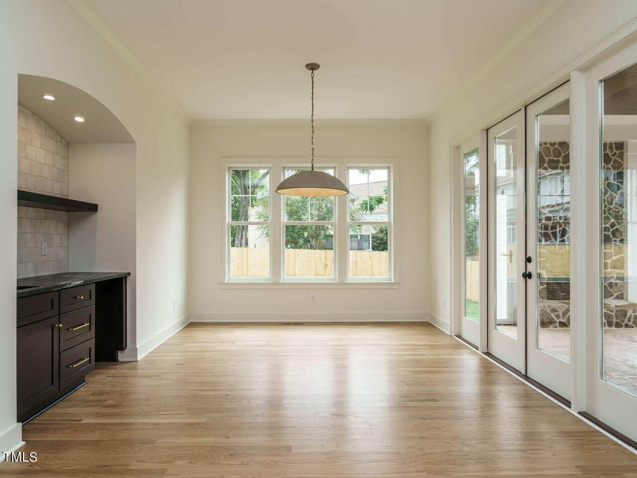 1706 Center Road Raleigh, NC 27608 - Photo 11 of 44 a view of wooden floor and windows in a room