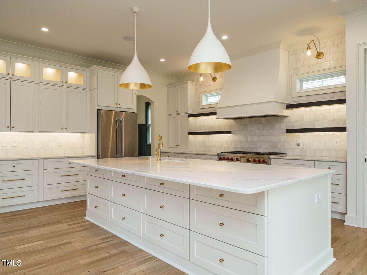 1706 Center Road Raleigh, NC 27608 - Photo 13 of 44 a kitchen with a white wooden cabinets and white appliances