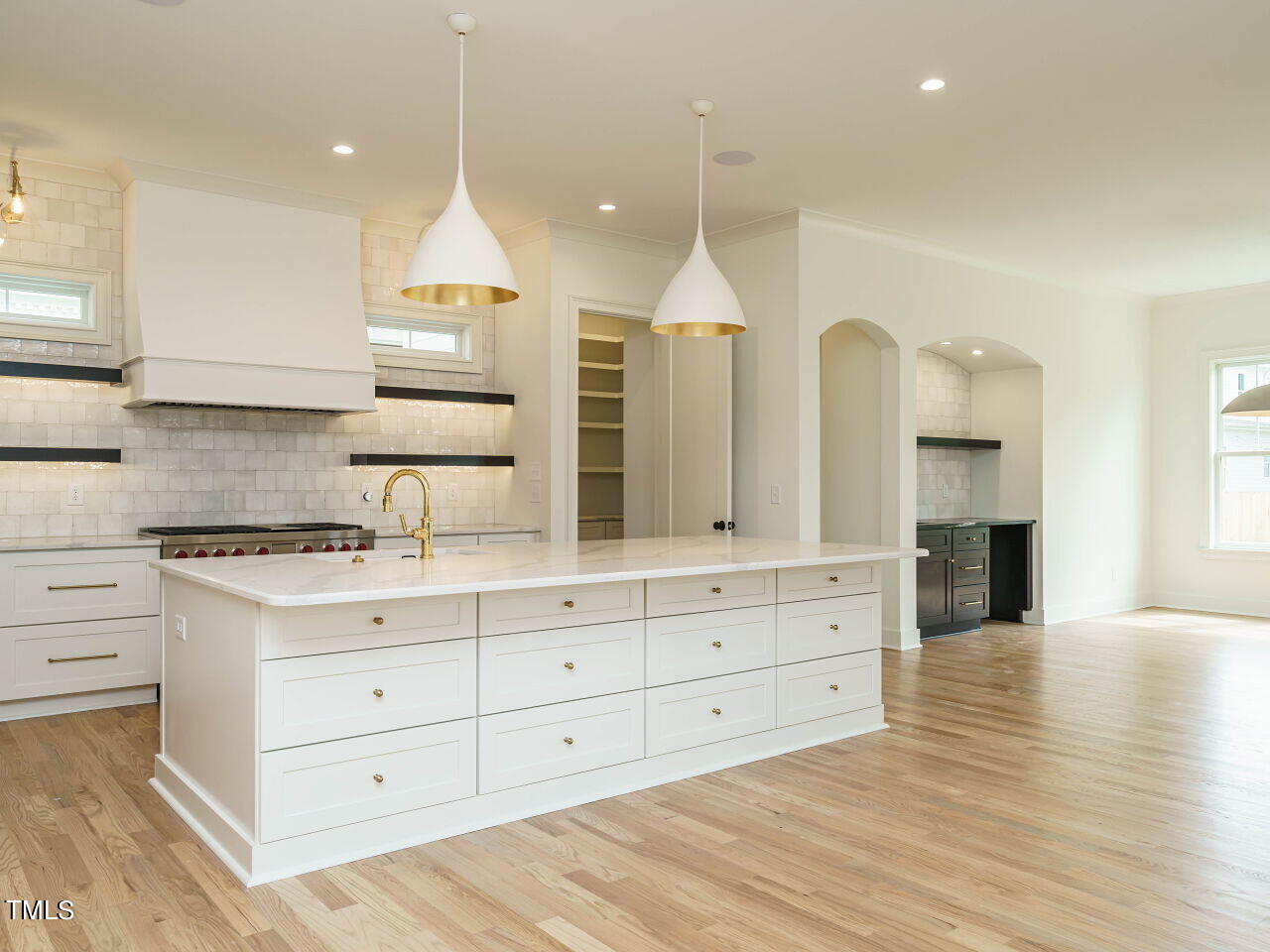 1706 Center Road Raleigh, NC 27608 - Photo 15 of 44 a kitchen with a white wooden cabinets and stove top oven