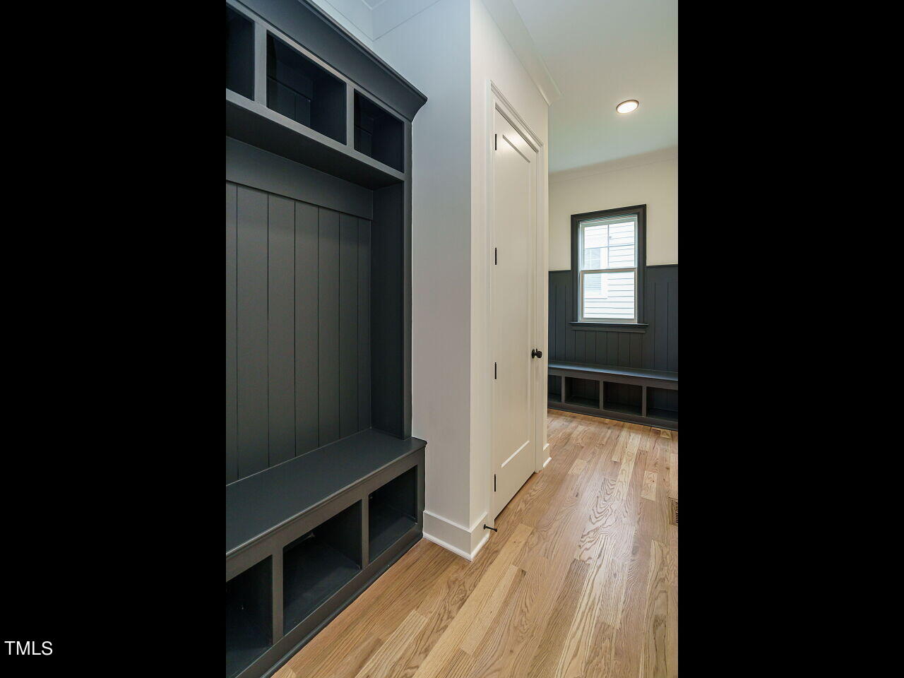 1706 Center Road Raleigh, NC 27608 - Photo 20 of 44 a view of a hallway with wooden floor and closet
