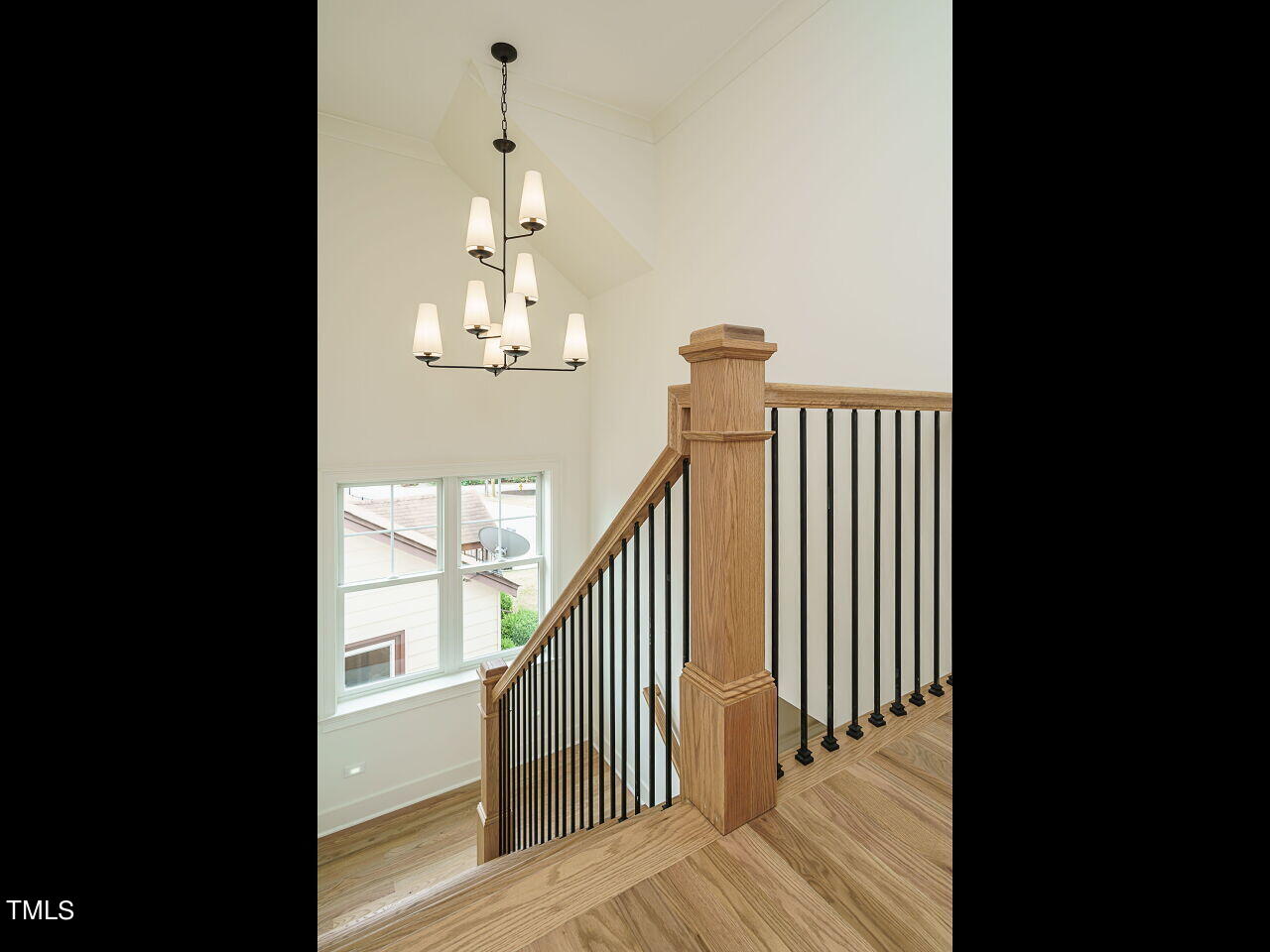 1706 Center Road Raleigh, NC 27608 - Photo 22 of 44 a view of a room with wooden floor and staircase