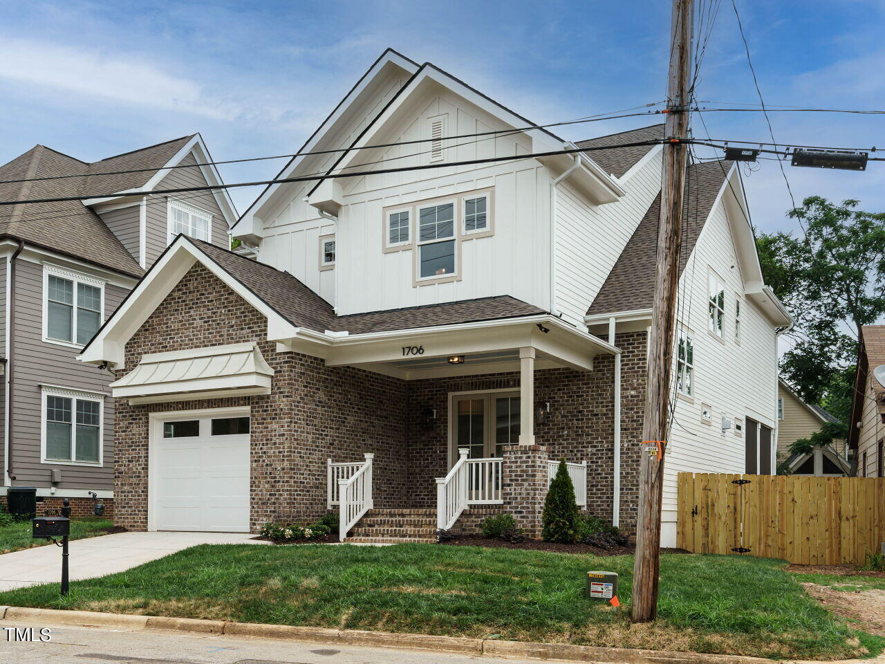 1706 Center Road Raleigh, NC 27608 - Photo 3 of 44 a view of a white house next to a yard