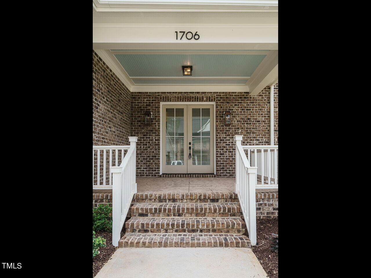 1706 Center Road Raleigh, NC 27608 - Photo 4 of 44 a front view of a house with a garden