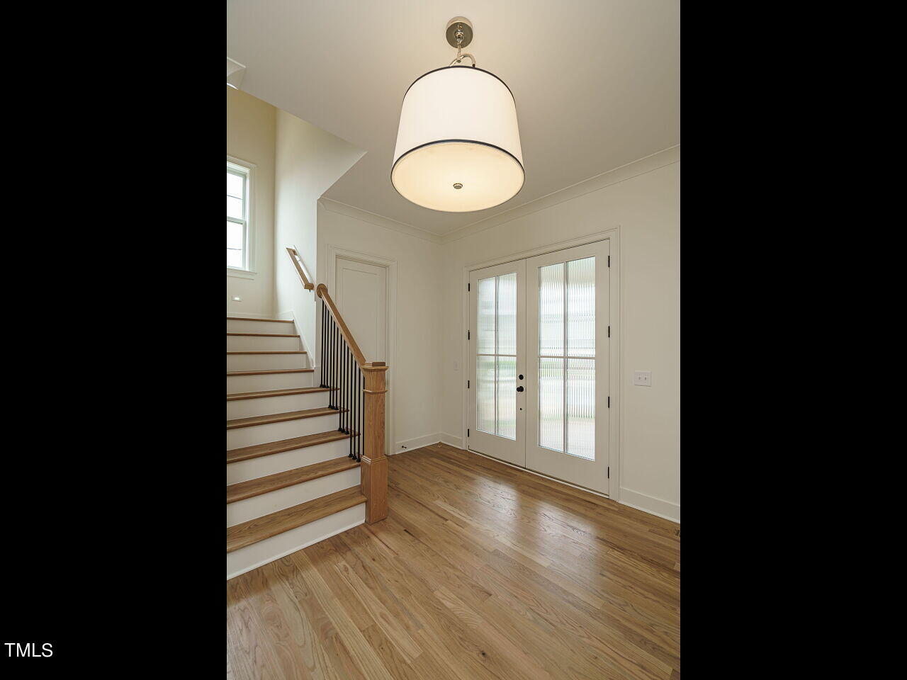 1706 Center Road Raleigh, NC 27608 - Photo 5 of 44 a view of an room with wooden floor and windows