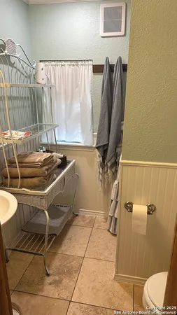 a room with table chairs and a wooden floor