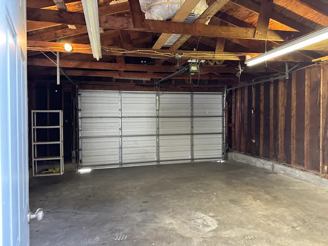 a view of an empty room with a white house